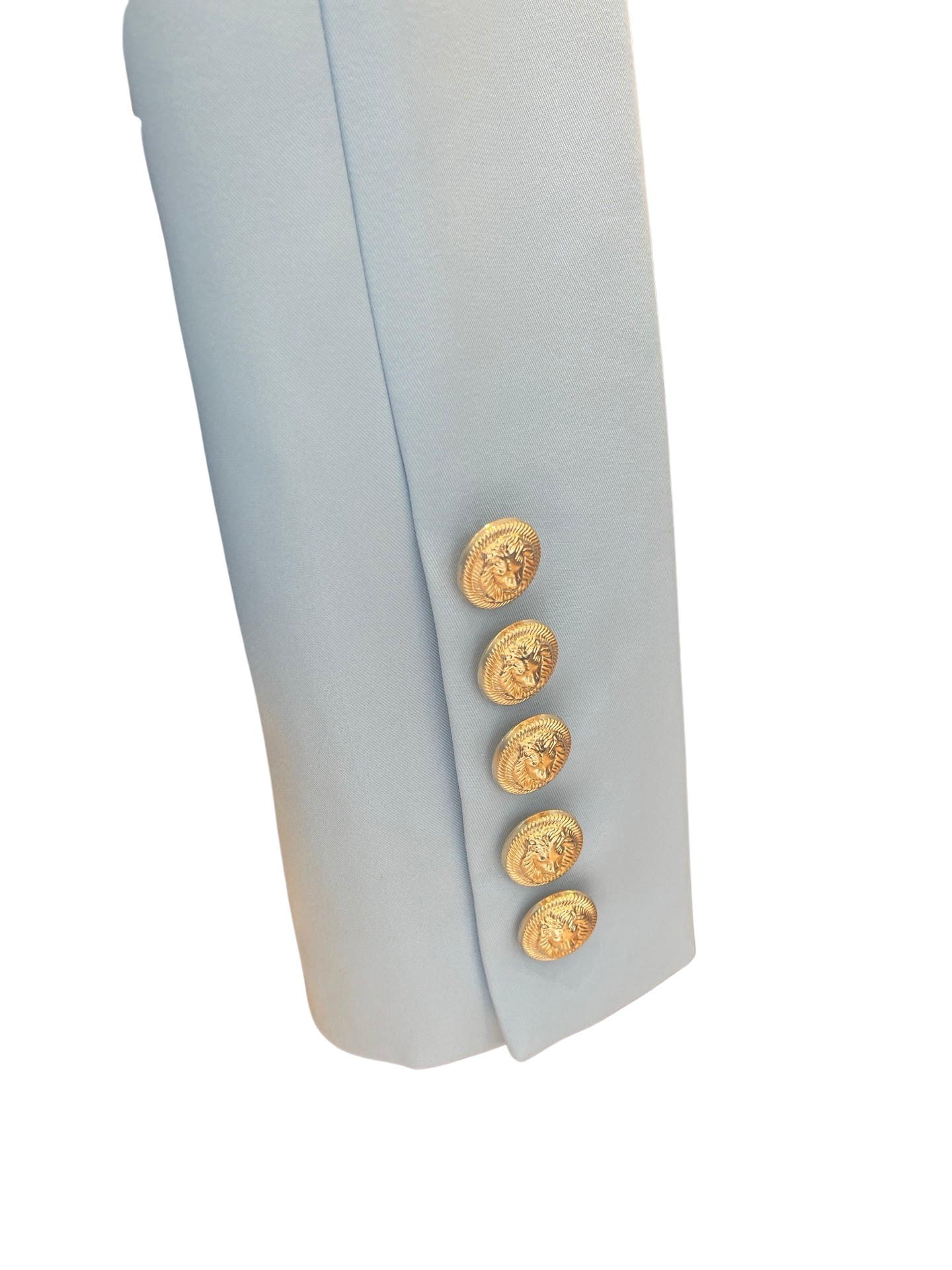 Pale blue sleeve with 6 small gold buttons on cuff