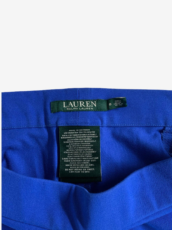 Close-up of the inside neck of a bright royal blue garment, showing a dark green Lauren Ralph Lauren brand label and a care tag.