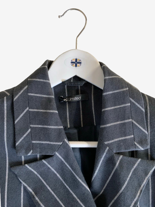 A gray pinstripe blazer jacket with white vertical stripes, hanging on a white hanger with a small Union Jack logo against a plain white background.