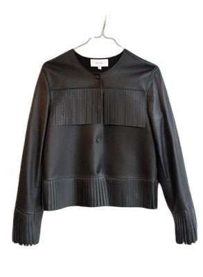 A black lambskin leather cropped jacket with pleated details on the chest and cuffs, hanging on a white hanger against a plain white background.