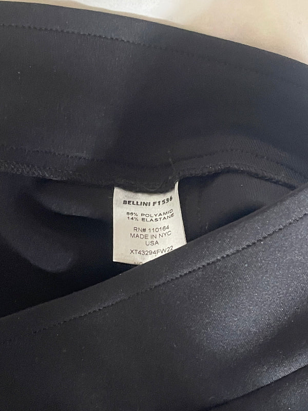 Close-up of a black garment's inner lining and sewn-in size label, showing the BELLINI brand name and fabric composition.