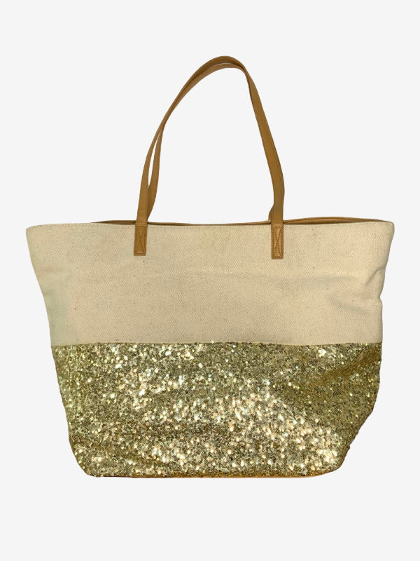 A canvas tote bag with a natural beige top half, a gold glittery sequin-covered bottom half, and tan shoulder straps, shown against a plain white background.