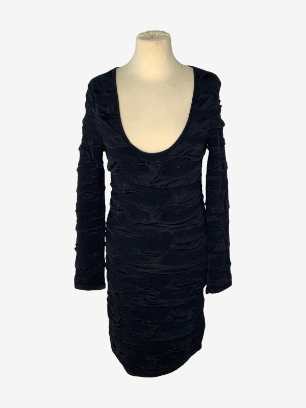 A black long-sleeve ruched dress displayed on a cream-colored mannequin torso against a light gray background.
