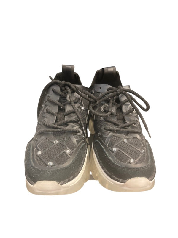 Black trainers with diamond criss cross pattern