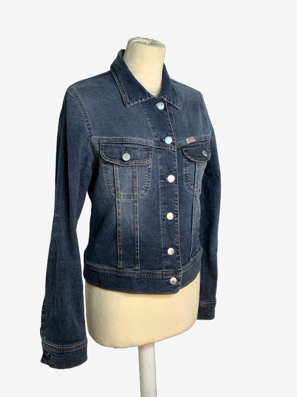 A dark wash blue denim jacket displayed on a cream-colored mannequin torso against a light gray background.