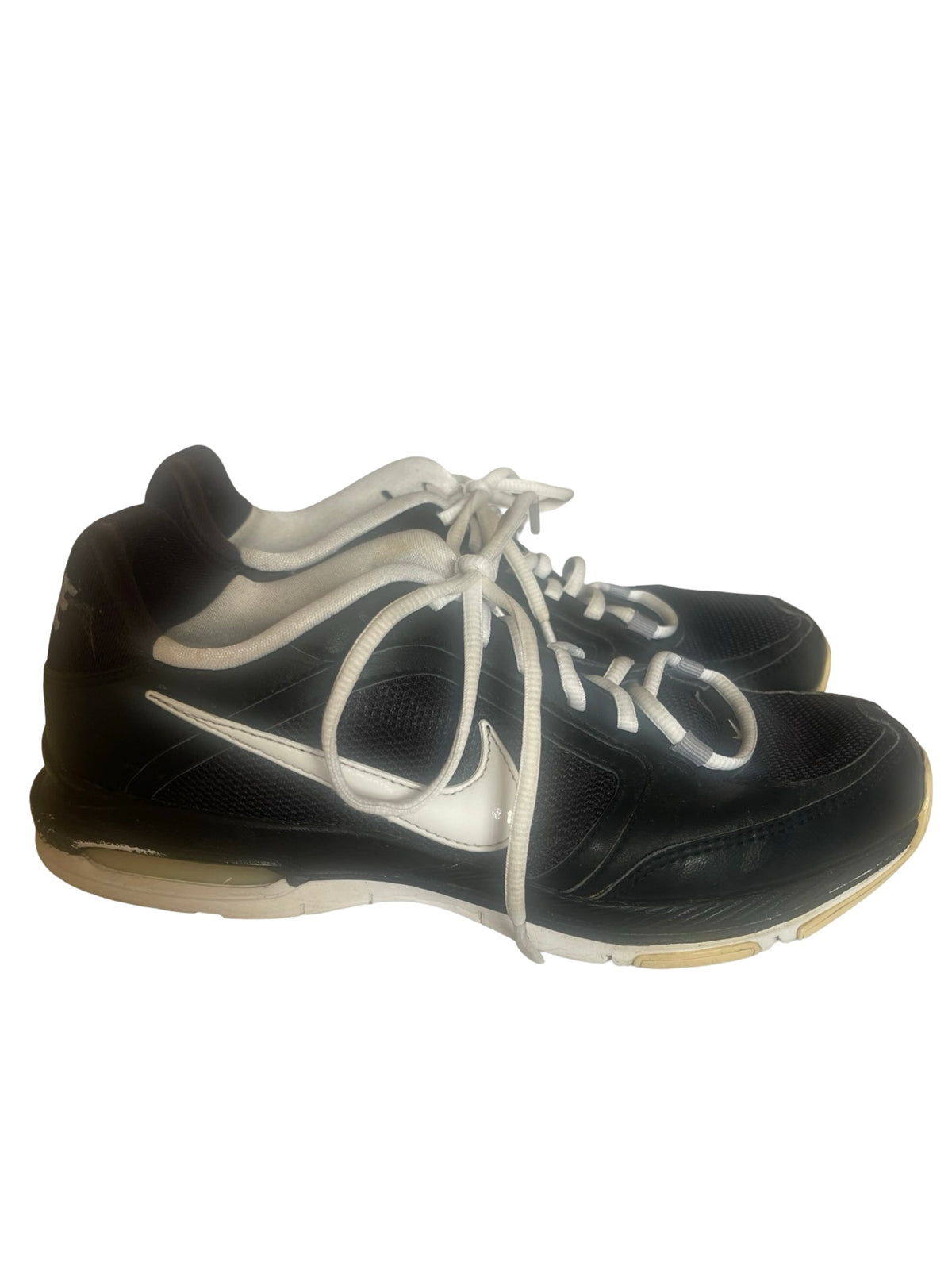 A pair of black Nike athletic sneakers with white laces and a white Swoosh logo, shown against a plain white background.