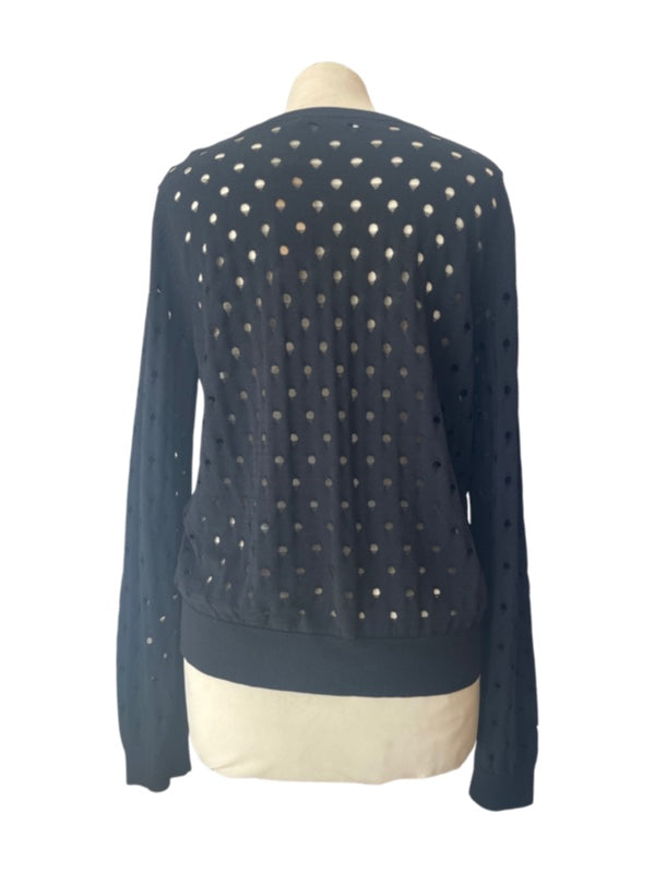 Back of black cardigan with holes detail