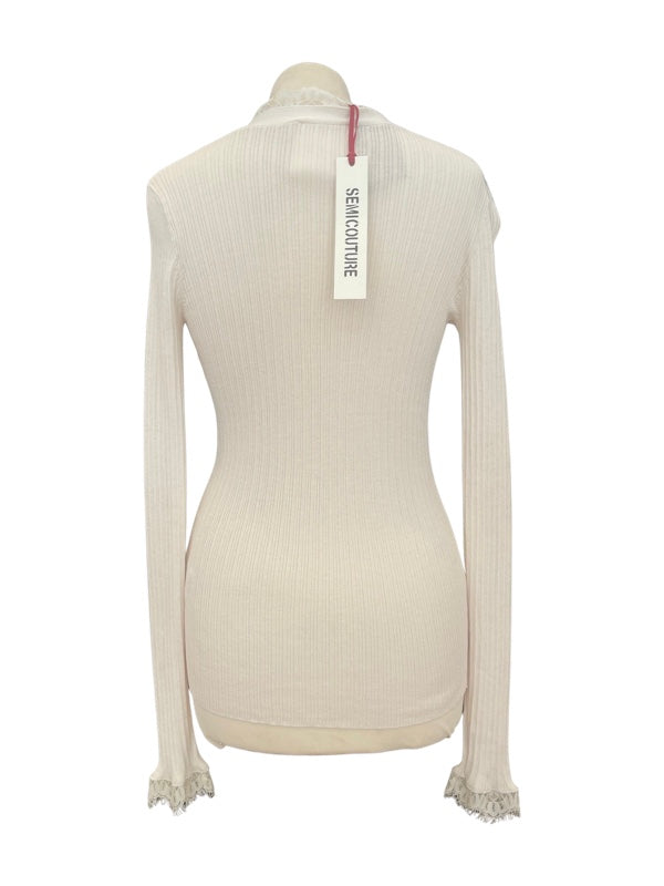 Cream cardigan back with tags at neck