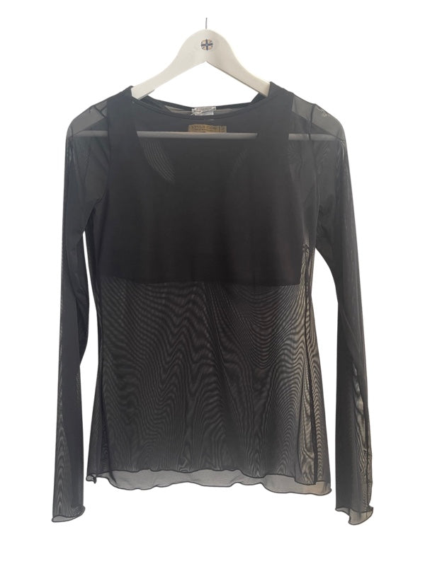 See through sheer t shirt styled over a black bra top
