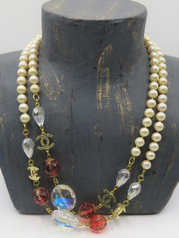 Chanel pearl necklace with poured glass crystals and diamond studded CC