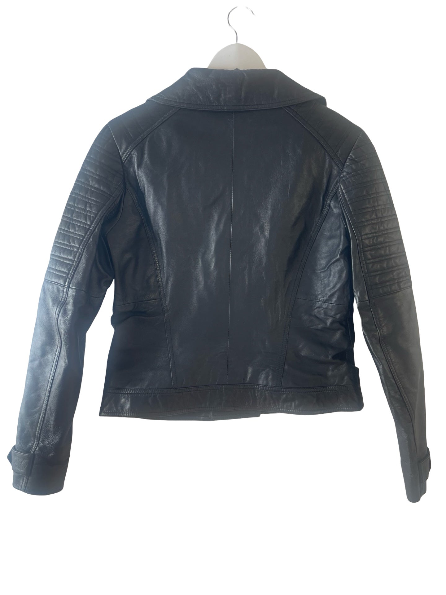 Black leather moto jacket with ribbed sleeve panels, shown from the back on a white hanger against a white background.