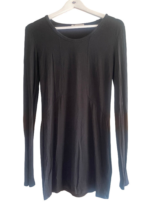 A black long-sleeve tunic top with a wide scoop neckline, hanging on a white wooden hanger against a plain white background.