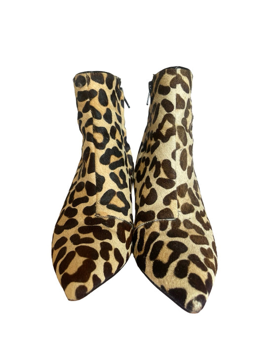 A pair of pointed-toe ankle boots with a leopard print pattern in beige, brown, and black, shown against a plain white background.