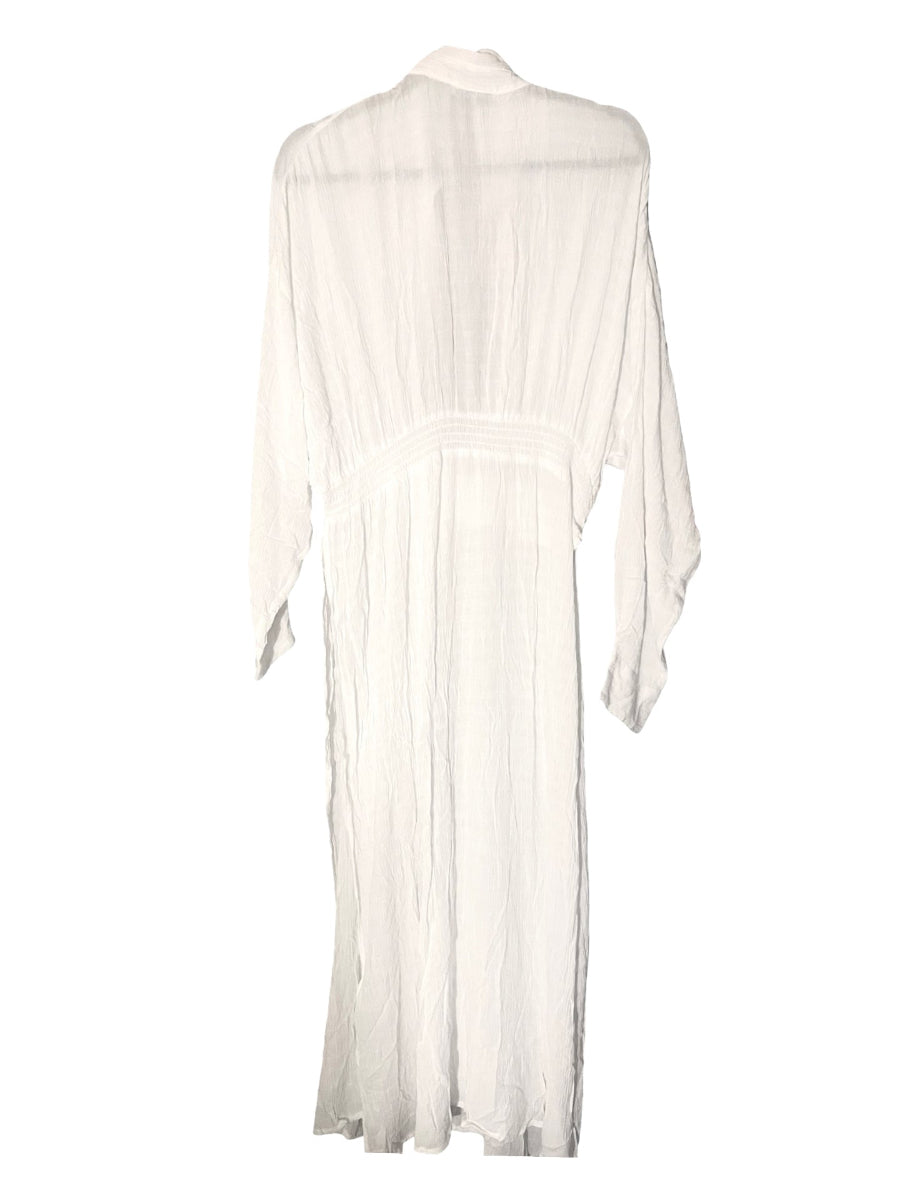 A white long-sleeved maxi dress with a high neck and gathered waist, shown from the back against a plain white background.