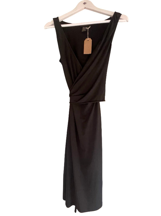 A black sleeveless wrap-style dress with a draped waist, hanging on a white wooden hanger against a plain white background.