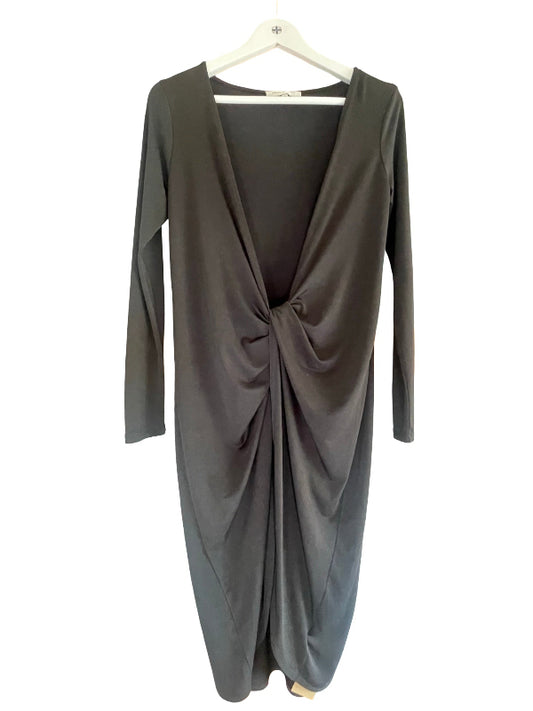 A black  long-sleeve wrap dress with a twisted front detail, hanging on a white hanger against a plain white background.