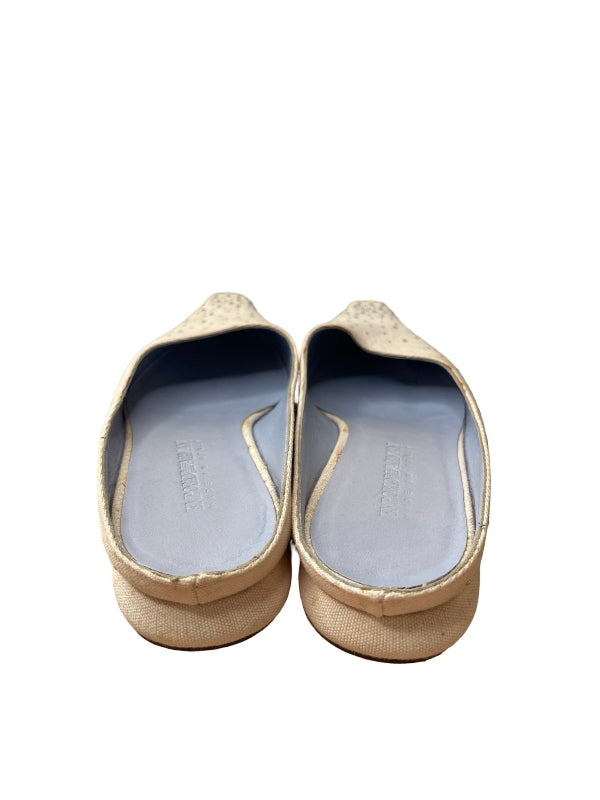 A pair of pink slip-on shoes with a textured fabric upper and a light blue insole, shown from a top-down view on a white background.