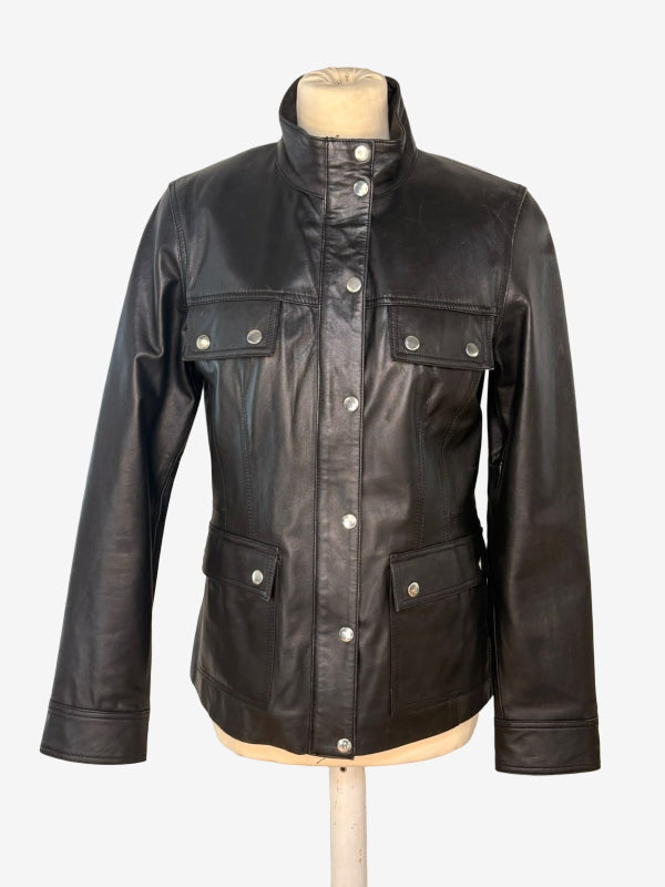 A black leather jacket with a high stand collar, button front, and four front pockets, displayed on a beige mannequin torso against a light gray background.