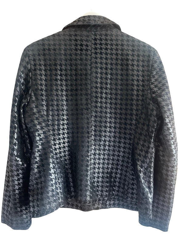 A black and black tone houndstooth patterned jacket displayed on a mannequin torso against a plain white background.