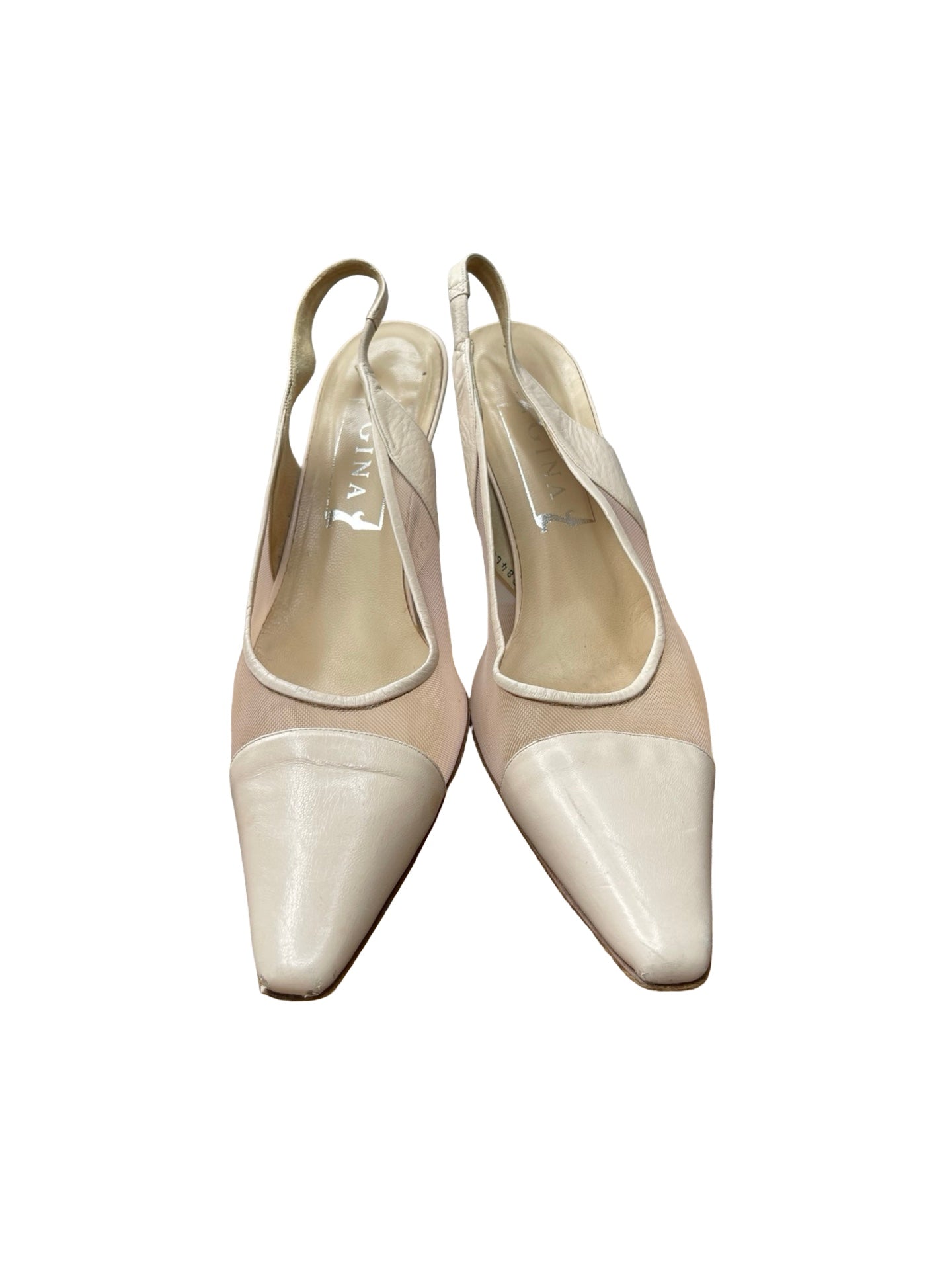 A pair of pointed-toe slingback heels in a light beige and cream colorway, shown from a top-down view on a white background.