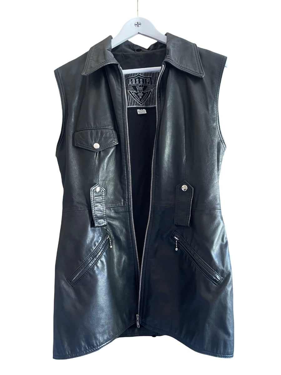 Black real leather motorcycle vest with a front zipper, snap button chest pockets, and zippered side pockets, hanging on a white hanger against a white background.