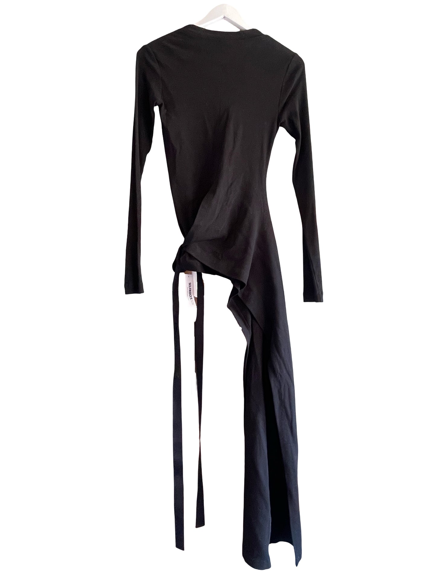 A black long-sleeve wrap-style top with an asymmetrical tail and tie detail, shown hanging against a plain white background.