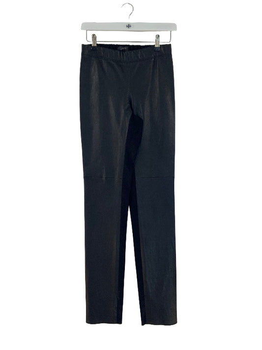 Black faux leather  pants with a wide elastic waistband, hanging on a white hanger against a white background.