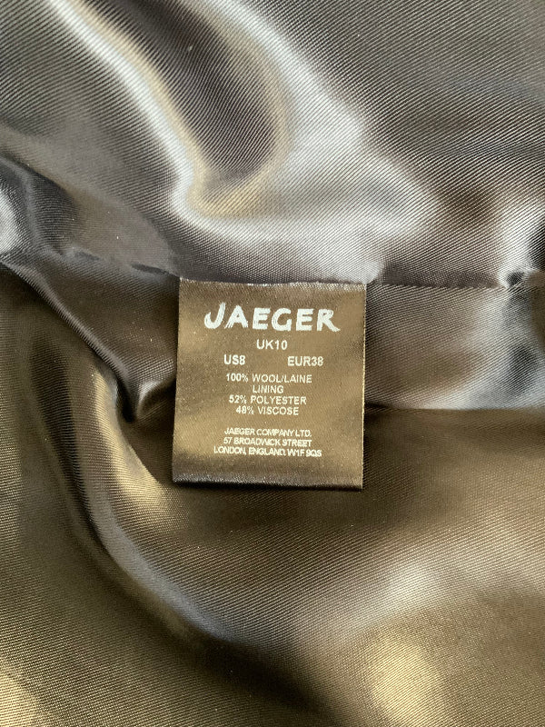 A close-up of a Jaeger brand fabric label sewn onto the inside of a shiny dark gray satin garment.