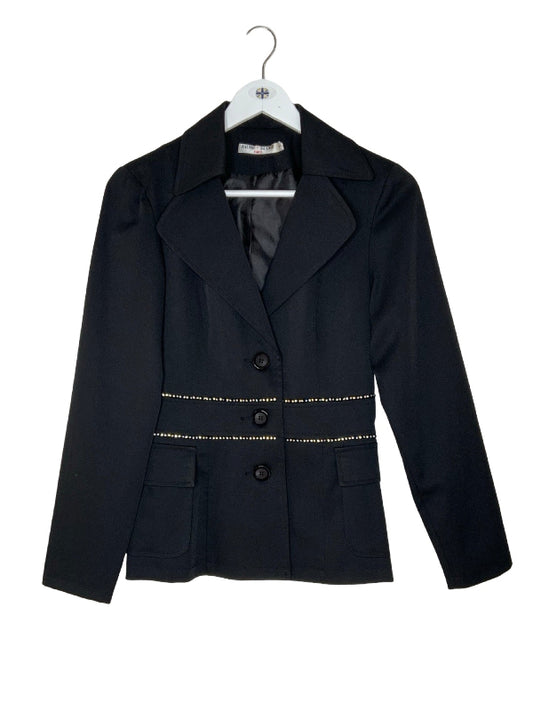 A black tailored blazer jacket with notched lapels, three front buttons, and decorative gold bead trim at the waist, hanging on a white hanger against a plain white background.