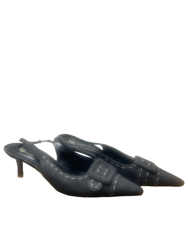 A pair of denim pointed-toe slingback heels with decorative buckle straps and contrast stitching, shown on a plain white background.