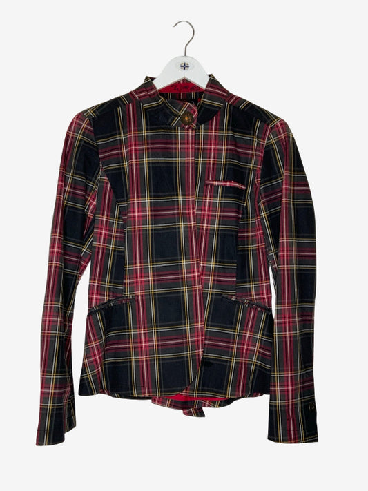 A long-sleeve plaid jacket in black, red, and yellow tartan, hanging on a white hanger against a light gray background.