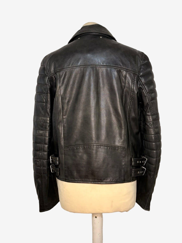 A black leather motorcycle jacket shown from the back on a cream-colored mannequin torso, set against a plain white background.