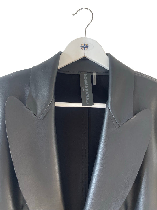 A dark grays leather  with structured peak lapels, hanging on a white wooden hanger with a small Union Jack logo, against a plain white background