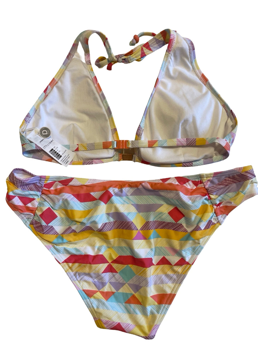 A two-piece bikini set with a colorful geometric triangle pattern, laid flat on a white background. The top has halter ties, and the bottom is a high-waisted ruffle-front style.
