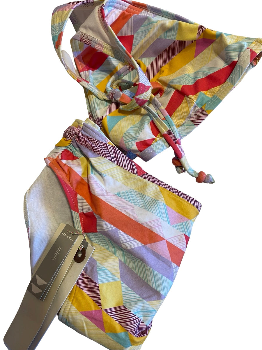 A colorful geometric print bikini set with a tie-front top and matching bottoms, shown on a plain white background. The print features diagonal stripes and triangles in yellow, red, orange, purple, and blue, with a light beige/silver-tone plastic slide insert visible on the left side.