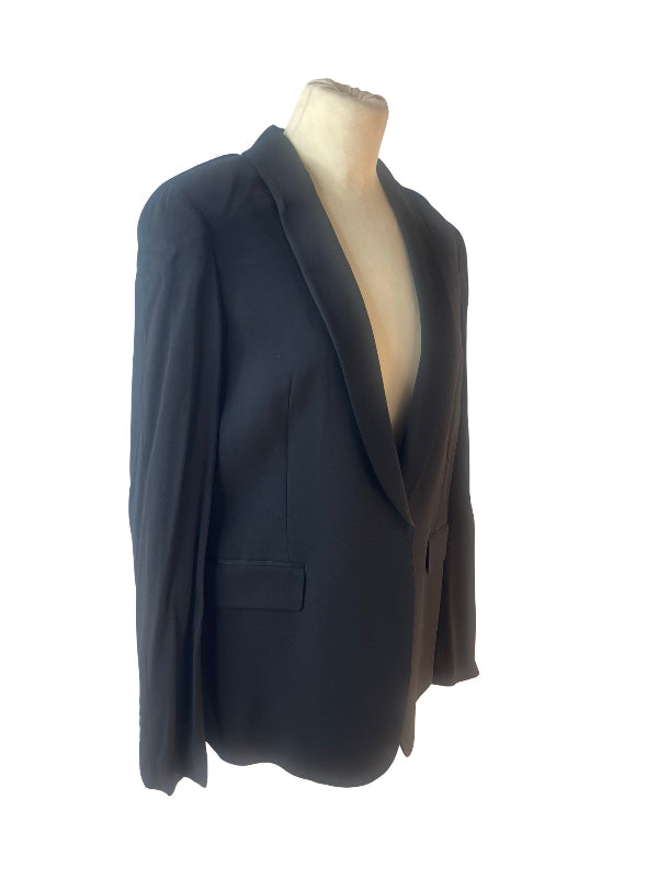 A black tailored blazer displayed on a beige mannequin torso against a plain white background.