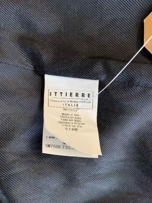 A close-up of a black  textured lining fabric garment showing a sewn-on brand label for ITTIERRE, with a white paper tag attached.
