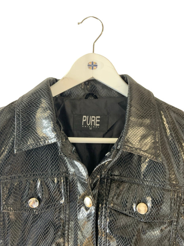 A close-up of a black snakeskin-patterned jacket hanging on a white wooden hanger against a white background. The jacket has a glossy finish, silver-tone snap buttons, and a black inner label reading 'PURE'.