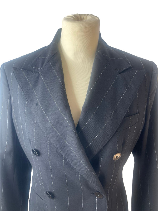 A double-breasted pinstripe blazer displayed on a beige mannequin torso against a plain white background with slight flaw on right lapel