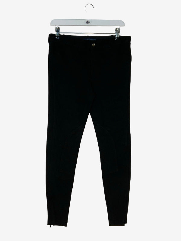 Black slim-fit jodphurs hanging from a white plastic hanger against a light gray background.