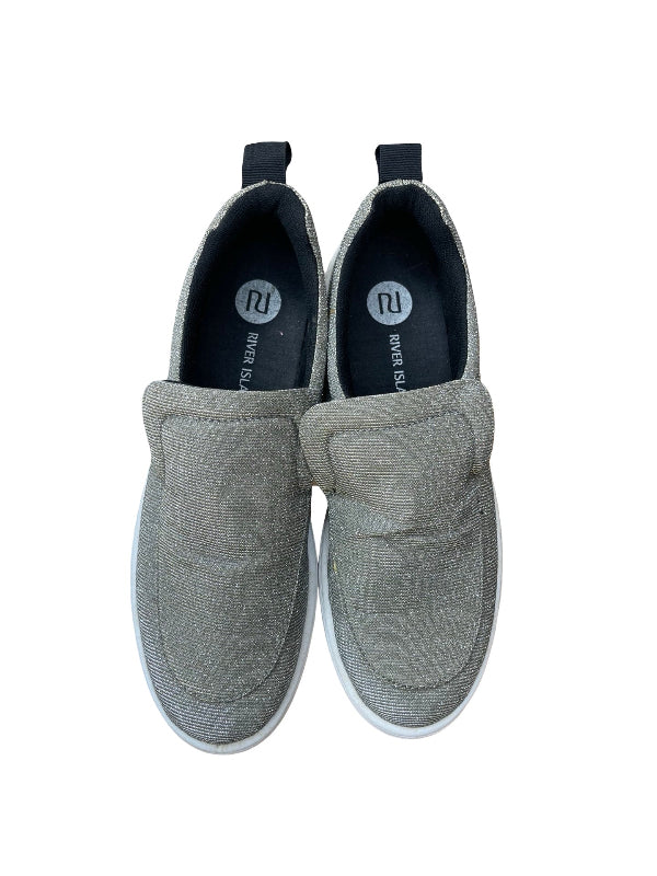 A pair of slip-on canvas shoes in a textured gray fabric with white soles, shown from a top-down view on a white background.