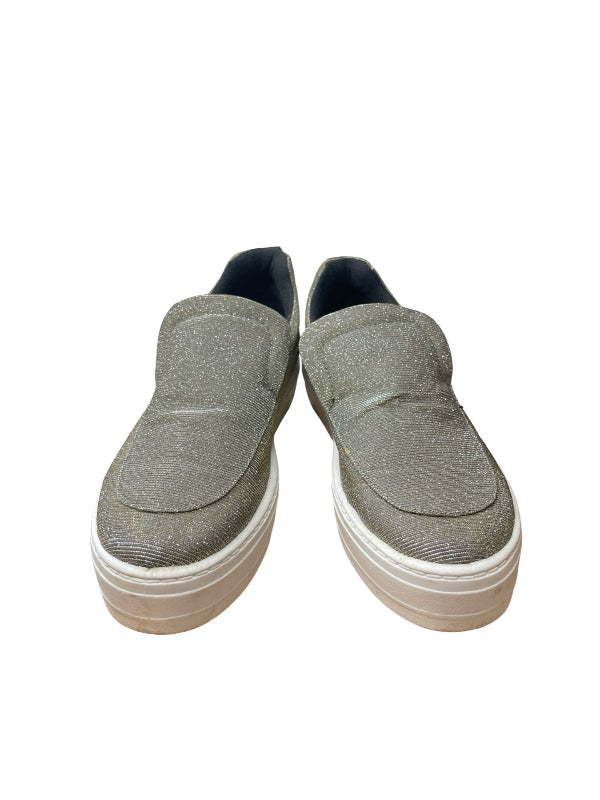 A pair of women's slip-on platform sneakers in a textured silver gray fabric with a white layered sole, shown against a plain white background.