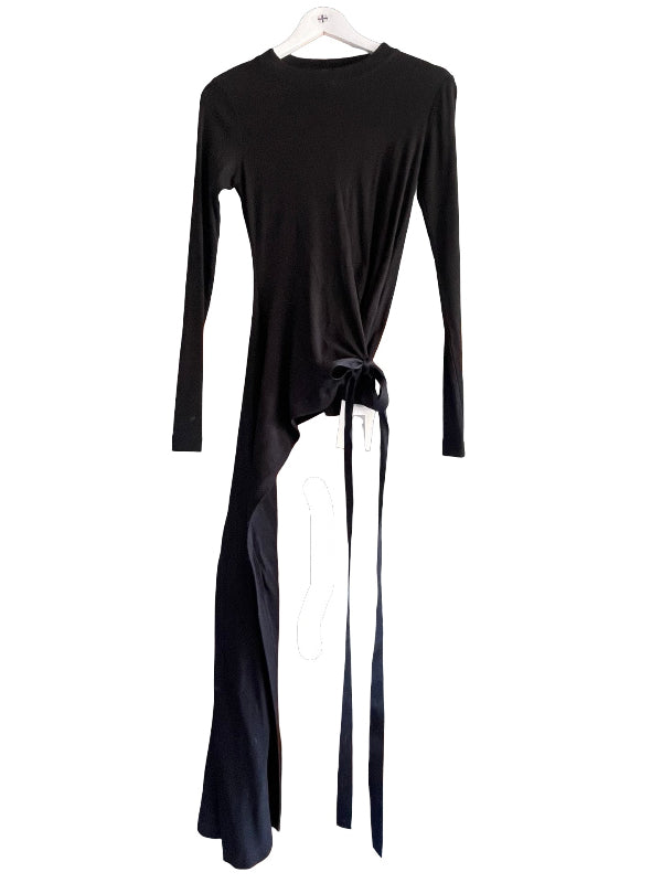 A black long-sleeve tie T shirt with an asymmetrical tail and tie-front detail, hanging on a white hanger against a plain white background.