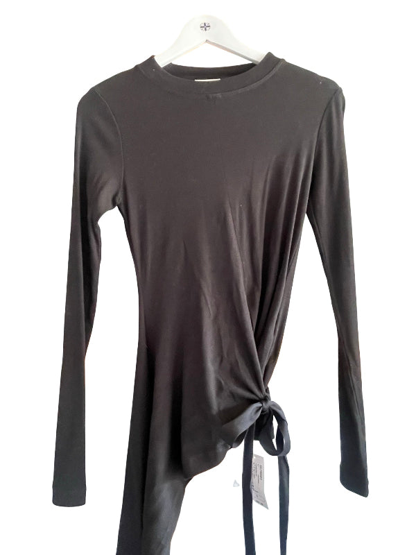 A dark gray long-sleeve top with an asymmetrical wrap-style hem and side tie, hanging on a white hanger against a white background.