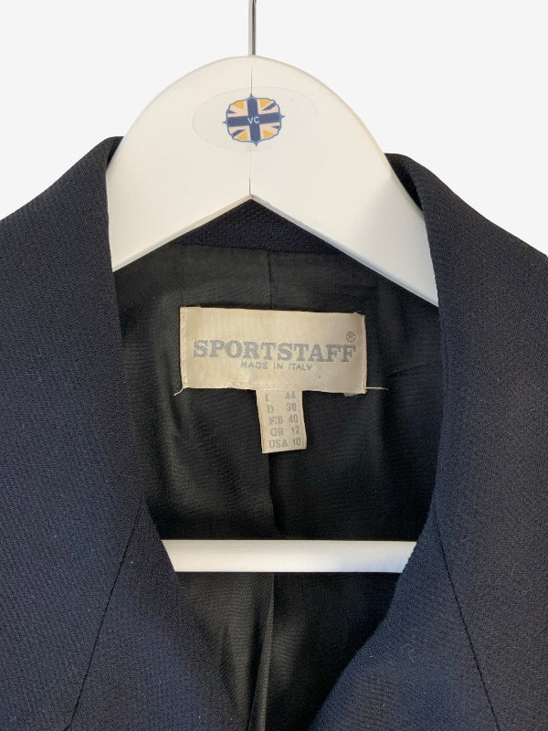 A close-up of a black Sportstaff blazer jacket hanging on a white hanger with a visible Sportstaff brand label inside the collar.