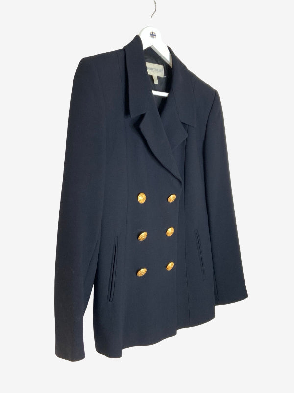 A black double-breasted blazer with gold buttons, hanging on a white hanger against a light gray background.