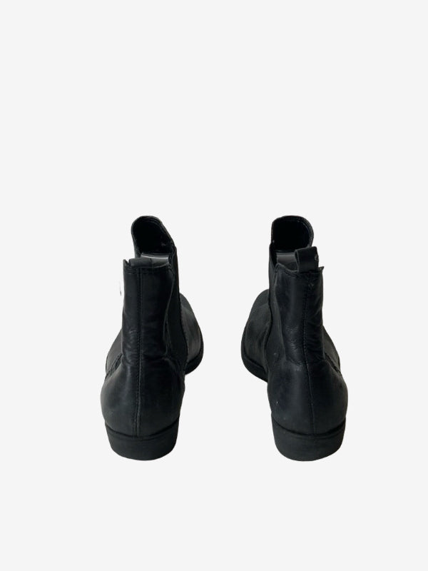 A pair of black leather ankle boots shown from the back against a plain white background.