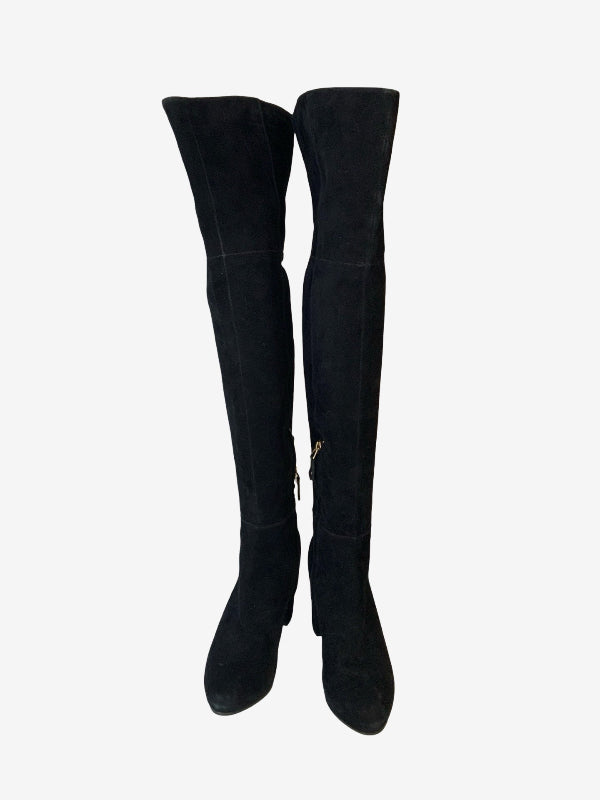 A pair of black faux suede over-the-knee boots with a pointed toe and a small gold zipper pull, shown against a plain light gray background.