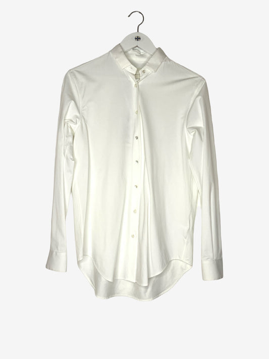 A white long-sleeve button-up shirt with a mandarin collar, hanging on a white hanger against a light gray background.