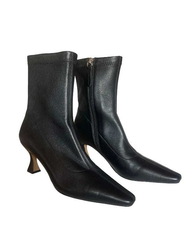 A pair of black leather ankle boots with pointed toes and low kitten heels, shown against a plain white background.